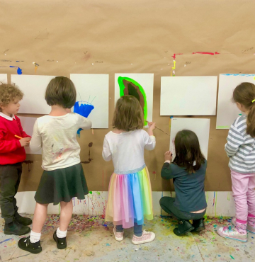 Five children painting.
