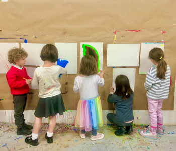 Five children painting.